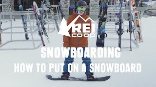 How to Put on Your Snowboard  REI [upl. by Verity450]